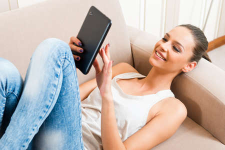 Beautiful young woman using a tablet