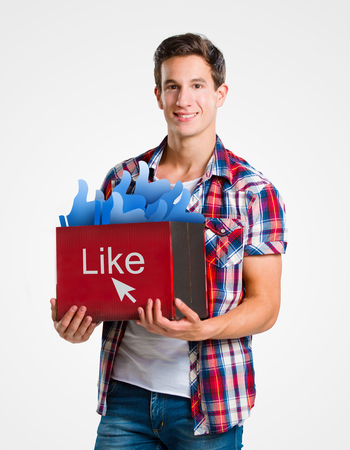 Young man holding a box of likes