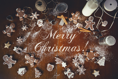 Christmas cookies on a dark table, top view with Merry Christmas message