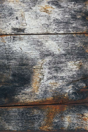 Old rusty wood panel with blue and orange colorsの写真素材