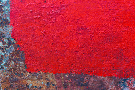 Red dirty grungy smudgy weathered red metal steel concrete wall backgroundの写真素材