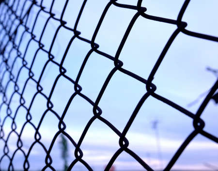 metal wire fence or cage with blue sky beautiful background.