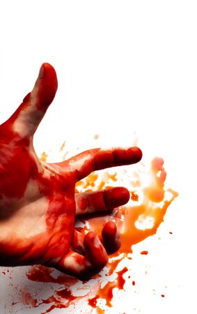 Male bloodied hand on a white background with splashes and drops of blood.の写真素材