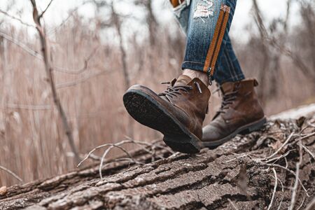 Guy hiking in comfortable hiking boots. Boots close-up stock photo.の写真素材
