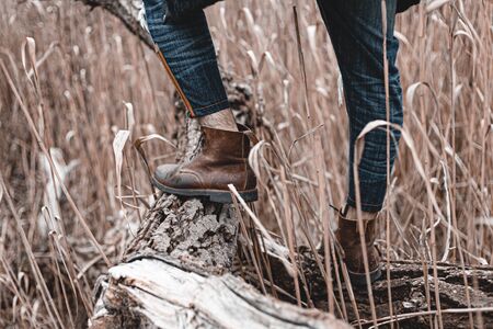 Guy hiking in comfortable hiking boots. Boots close-up stock photo.の写真素材
