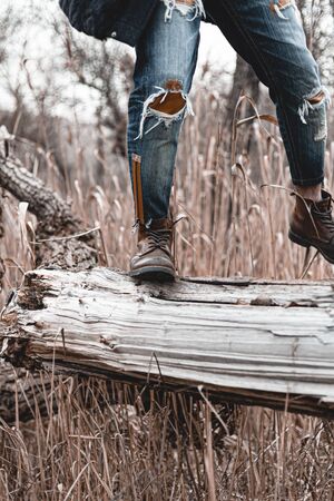 Guy hiking in comfortable hiking boots. Boots close-up stock photo.の写真素材