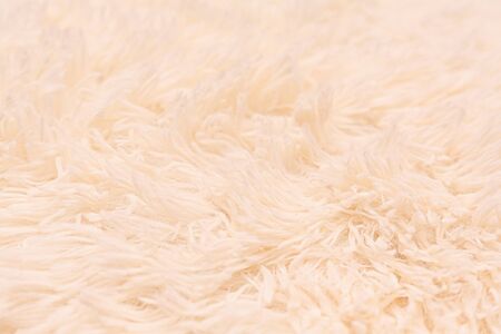 The texture of the bedspread grass. Stock photo bedspread beige.