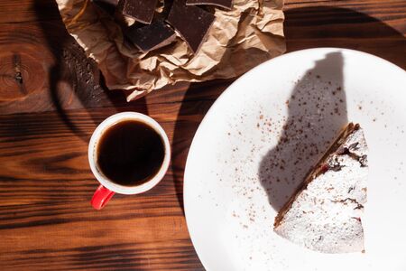 Coffee with chocolate and cake dessert on a wooden table.の写真素材