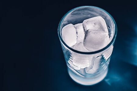Ice cubes in a glass. Ice in a glass is highlighted.の写真素材