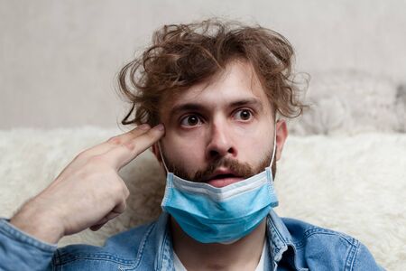 Lone guy at home in quarantine. Staying at home makes you sad and crazy. Home isolation and its...