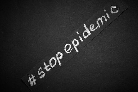 Stop epidemic. The inscription on a black background.の写真素材