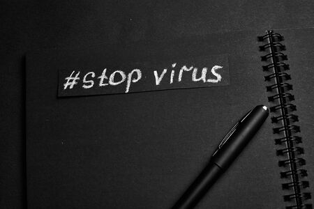Stop virus. The inscription on a black background.の写真素材