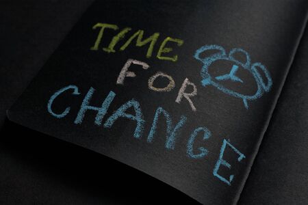 Time for a change. Handwritten concept in a black notebook. Business strategy, plan, goal.の写真素材