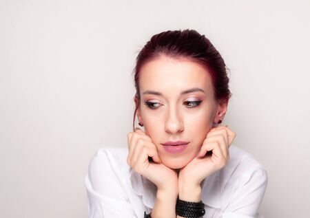 Portrait of a makeup girl on a light background.の写真素材