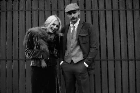 Portrait of a beautiful couple in vintage style. Retro style, classic clothes.