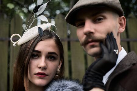 Portrait of a beautiful couple in vintage style. Retro style, classic clothes.