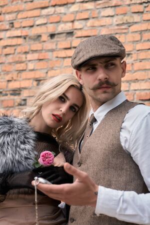 Portrait of a beautiful couple in vintage style. Retro style, classic clothes.の写真素材