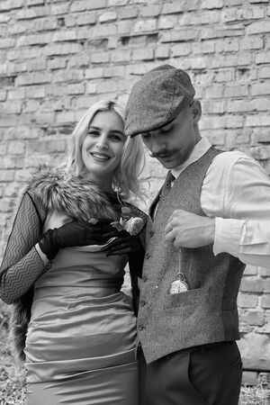 Portrait of a beautiful couple in vintage style. Retro style, classic clothes.