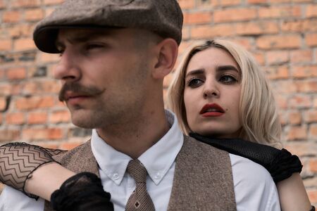 Portrait of a beautiful couple in vintage style. Retro style, classic clothes.の写真素材