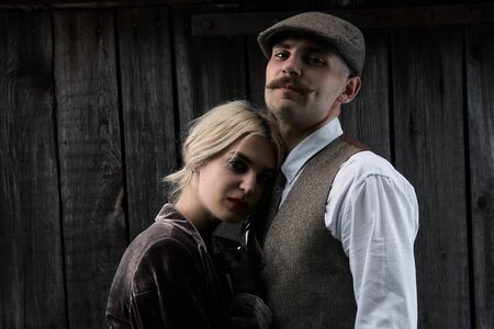 Portrait of a beautiful couple in vintage style. Retro style, classic clothes.の写真素材