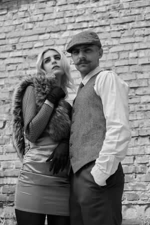 Portrait of a beautiful couple in vintage style. Retro style, classic clothes.の写真素材