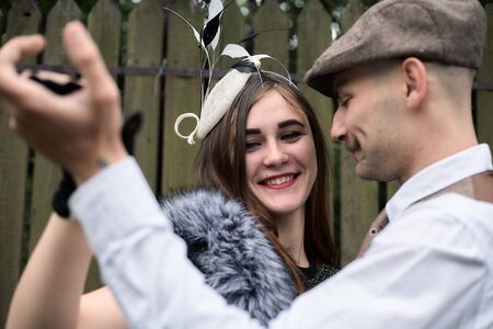 Portrait of a beautiful couple in vintage style. Retro style, classic clothes.の写真素材
