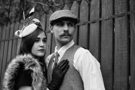 Portrait of a beautiful couple in vintage style. Retro style, classic clothes.の写真素材