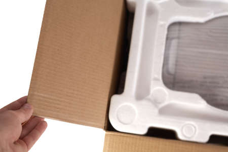 Open cardboard with polystrene material. Isolated on white background. Transportation of fragile...