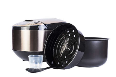 Automatic multicooker and accessories set isolated on a white background. Modern cooking appliance...