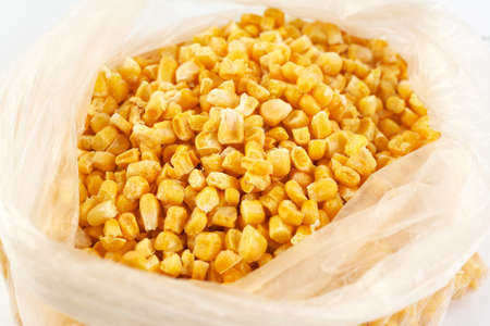 Frozen corn in a plastic bag. Reserve for the winter.の写真素材