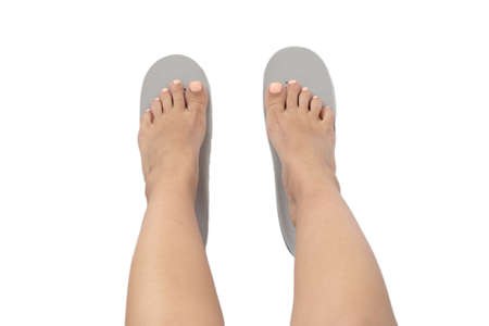 Female feet and insoles isolated on a white background. Top view.