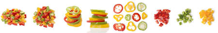 Ð¡hopped bell pepper rings and diced, sliced multicolor bulgarian pepper, isolated on white background. Top and side view. Set different close up capsicum pepper slice.の写真素材