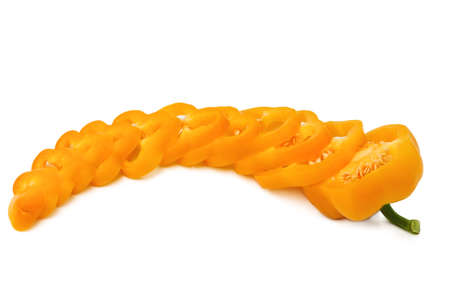 Chopped orange bell pepper isolated on a white background.の写真素材