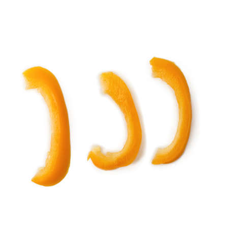 Chopped orange bell pepper isolated on a white background.の写真素材