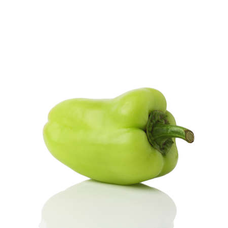Green bell pepper (sweet, capsicum, paprika) isolated on white background. One whole fresh vegetable with shade.の写真素材