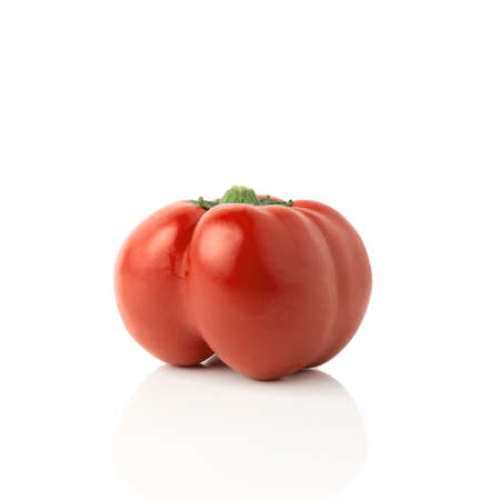 Red bell pepper (sweet, capsicum, paprika) isolated on white background. One whole fresh vegetable with shade.の写真素材