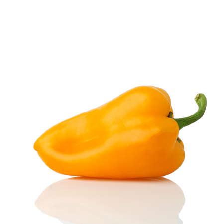 Bell pepper (sweet, capsicum, paprika) isolated on white background. One whole fresh vegetable with shade orange, yellow color.の写真素材