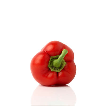 Red bell pepper (sweet, capsicum, paprika) isolated on white background. One whole fresh vegetable with shade.の写真素材