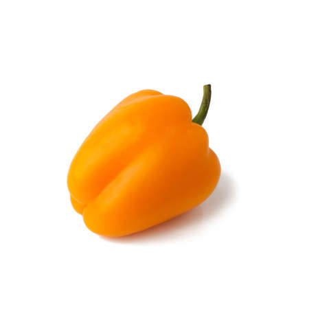 Bell pepper (sweet, capsicum, paprika) isolated on white background. One whole fresh vegetable with shade orange, yellow color.の写真素材