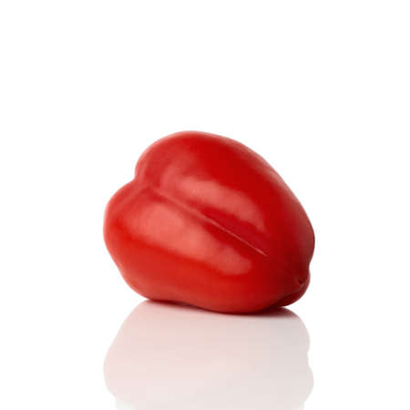 Red bell pepper (sweet, capsicum, paprika) isolated on white background. One whole fresh vegetable with shade.の写真素材