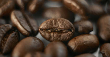 Coffee beans close up, background wallpaper. Macro photo of coffee.の写真素材