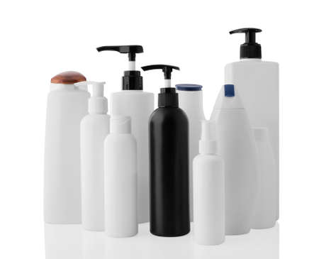 Set of white and black different plastic bottles and jars isolated on a clean white background, with reflection.の写真素材
