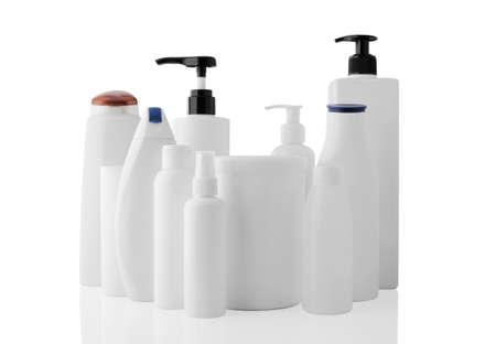 Set of white different plastic bottles and jars isolated on a clean white background, with reflection.の写真素材