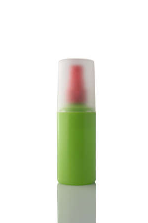 Green color spray bottle isolated on white background.の写真素材