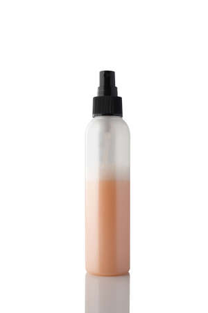 Spray bottle with colored liquid isolated on white background.の写真素材