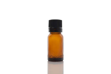 Glass vial of oil on a white background.の写真素材