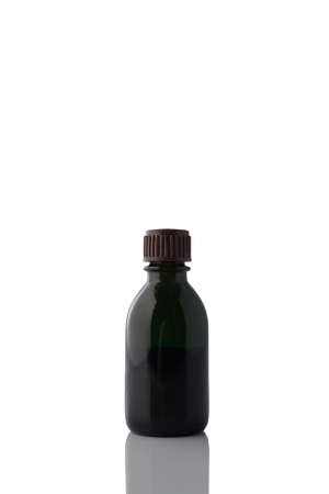 Glass vial of brilliant green on a white background.の写真素材