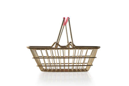 Empty metal grocery basket with raised handles for shopping in supermarket isolated on white background side view. Symbol of consumer society. Side view.の写真素材