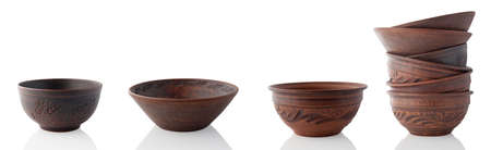 Clay bowls isolated on white background. Set of different earthenware.の写真素材