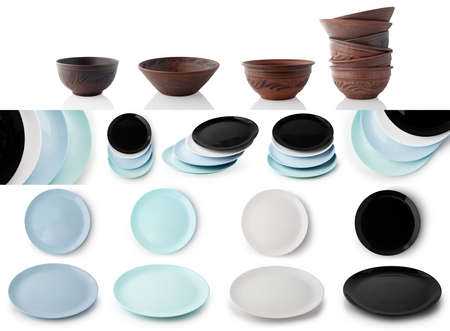 Set of empty plates and bowls of clay and ceramic isolated on white background.の写真素材